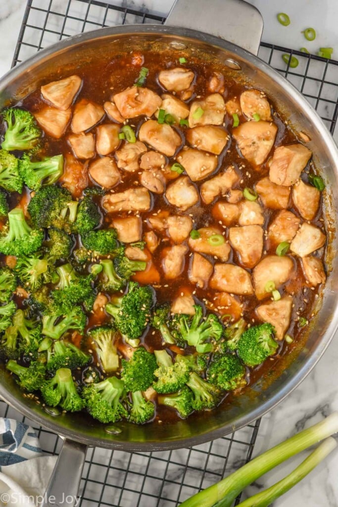 Overhead photo of teriyaki chicken rice bowl recipe in a skillet with broccoli.