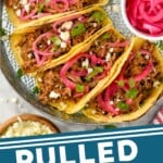 Pinterest graphic for pulled pork tacos recipe. Image is overhead photo of pulled pork tacos set up for serving with pickled red onions on the side. Text says, "Pulled Pork Tacos simplejoy.com."