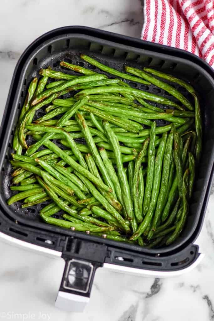 Overhead photo of Air Fryer Green Beans in an air fryer basket.