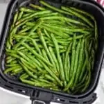 Overhead photo of Air Fryer Green Beans in an air fryer basket.