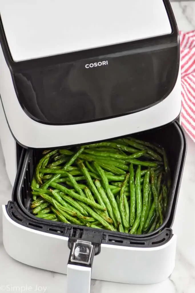 Overhead photo of Air Fryer Green Beans in an air fryer basket.