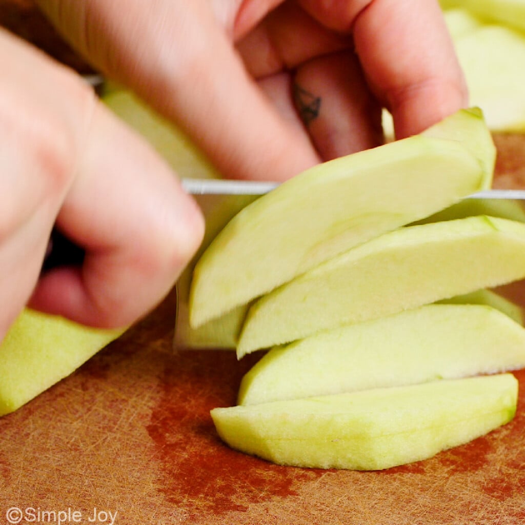 close up image of apples being sliced