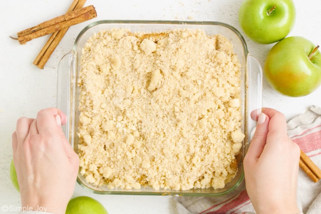 apple crisp in casserole dish ready to be baked