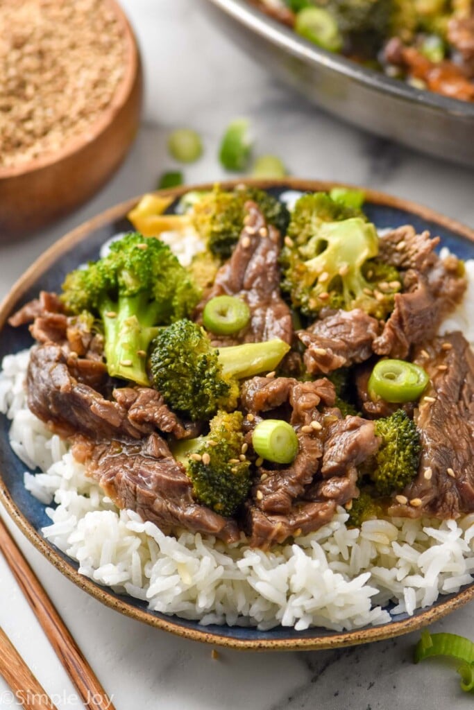 overhead of a bowl of beef teriyaki with broccoli served over rice