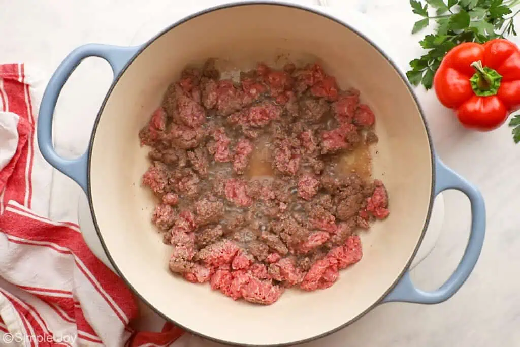 overhead of ground beef cooking in a soup pot