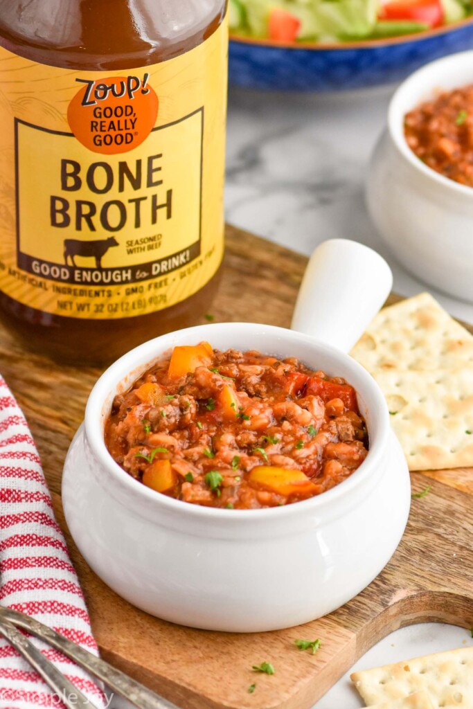 bowl of stuffed pepper soup with a jar of zoup beef broth behind it