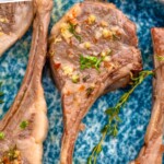 Pinterest photo of the best lamp chops with a close up photo of four cooked lamb chop, says 'the best lamb chop recipe simplejoy.com'