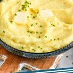 Pinterest graphic for mashed potatoes. Image shows bowl of mashed potatoes. Text says "mashed potatoes simplejoy.com"