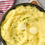 Pinterest graphic for mashed potatoes. Text says "the best mashed potatoes simplejoy.com" Image shows overhead of bowl of homemade mashed potatoes