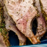 Pinterst photo of Roast Pork Loin with an overhead close up photo of cooked pork loin. Says 'the best roast pork simplejoy.com'