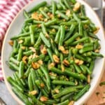 a serving platter of green beans almondine