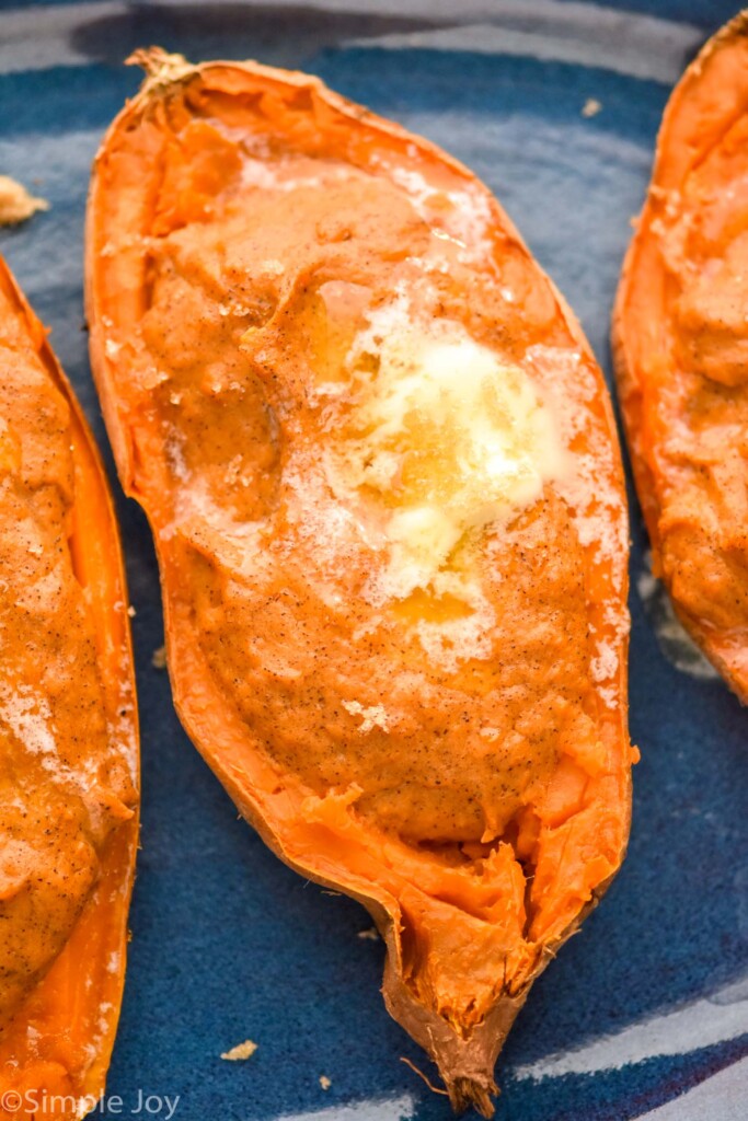Overhead photo of Twice Baked Sweet Potatoes garnished with butter and brown sugar.