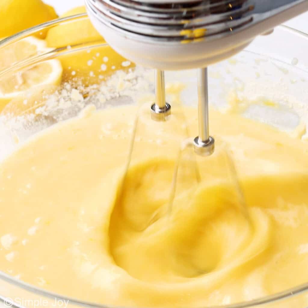 lemon filling for lemon bars being blende din a bowl