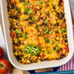 Pinterest graphic for Spaghetti Squash Casserole. Image is overhead photo of a baking dish of Spaghetti Squash Casserole. Text says, "Low carb southwest casserole simplejoy.com"