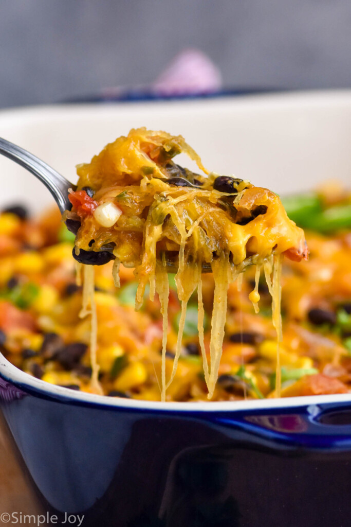 Photo of a spoonful of Spaghetti Squash Casserole coming out of baking dish.