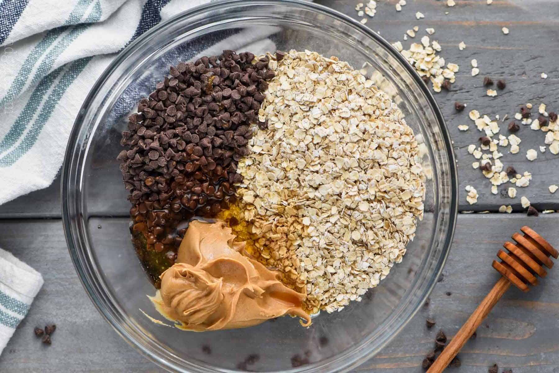 ingredients for no bake energy bites broken down by type in a bowl