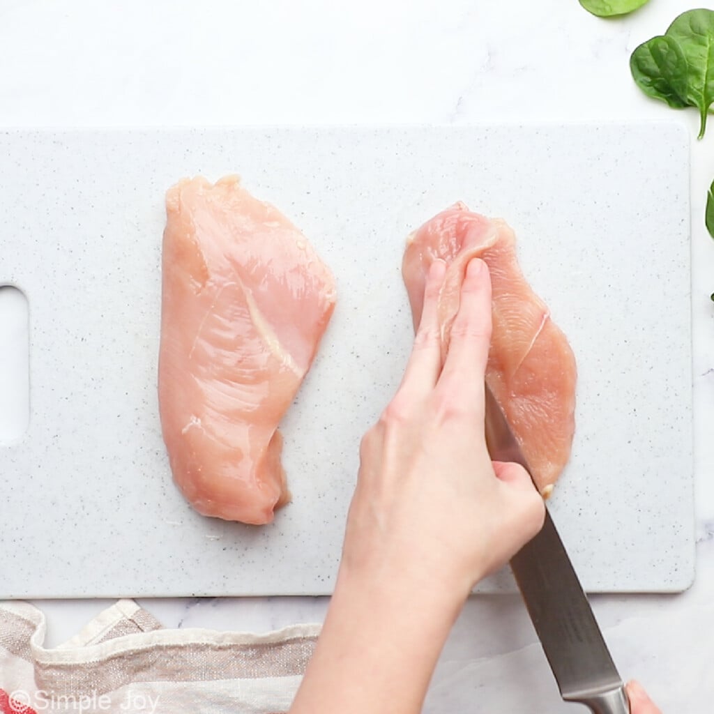 chicken breasts being butterflied open into chicken cutlets - 4