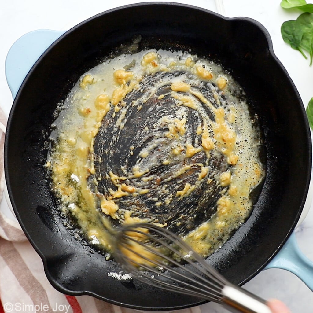 a roux being mixed together with a whisk