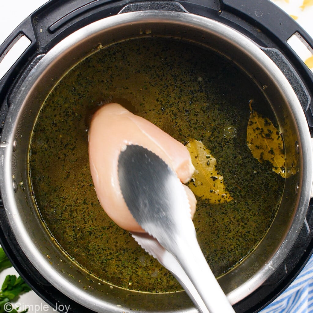 adding a chicken breast to soup in an instant pot