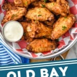 Pinterest graphic for Old Bay Chicken Wings. Image is overhead photo of Old Bay Chicken Wings served with homemade ranch dressing for dipping. Text says, "Old Bay Chicken Wings simplejoy.com: