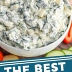 Overhead photo of Spinach Dip Recipe served in a bowl. Sliced peppers, cucumbers, and chips beside bowl for dipping. says: "the best spinach dip, simplejoy.com"