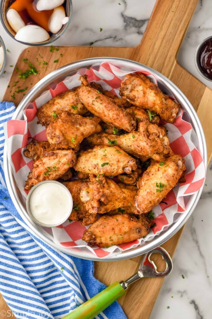 Overhead photo of Old Bay Chicken Wings served with homemade ranch dressing for dipping.