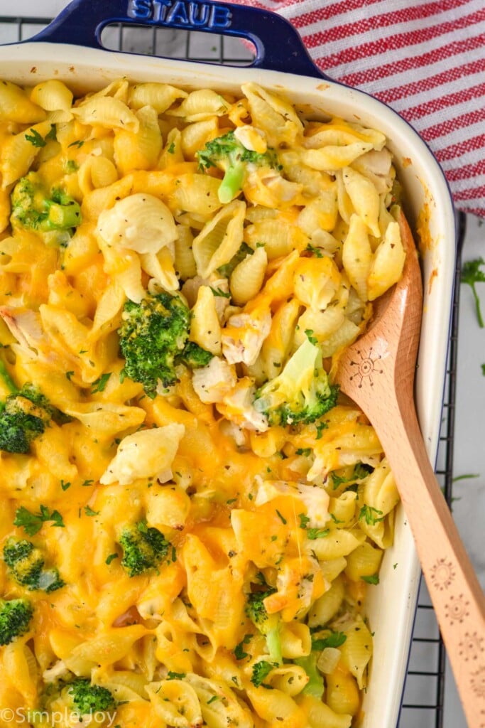 Overhead photo of a dish of Chicken Broccoli Noodle Casserole with a spoon for serving.
