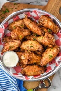 Overhead photo of Old Bay Chicken Wings served with homemade ranch dressing for dipping.