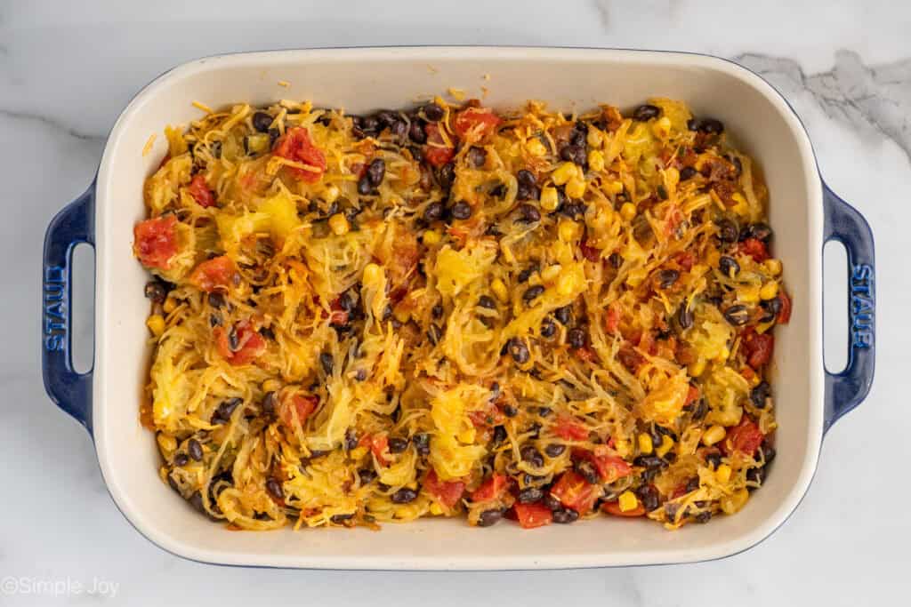 overhead of an uncooked spaghetti squash casserole in a baking dish