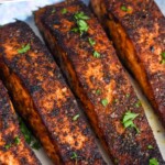 Pinterest graphic for Blackened Salmon recipe. Text says, "The best Blackened Salmon simplejoy.com." Image is close up photo of Blackened Salmon.