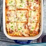 Pinterest graphic for Homemade Lasagna recipe. Image is overhead photo of a pan of Homemade Lasagna cut into squares. Text says, "Homemade Lasagna simplejoy.com."