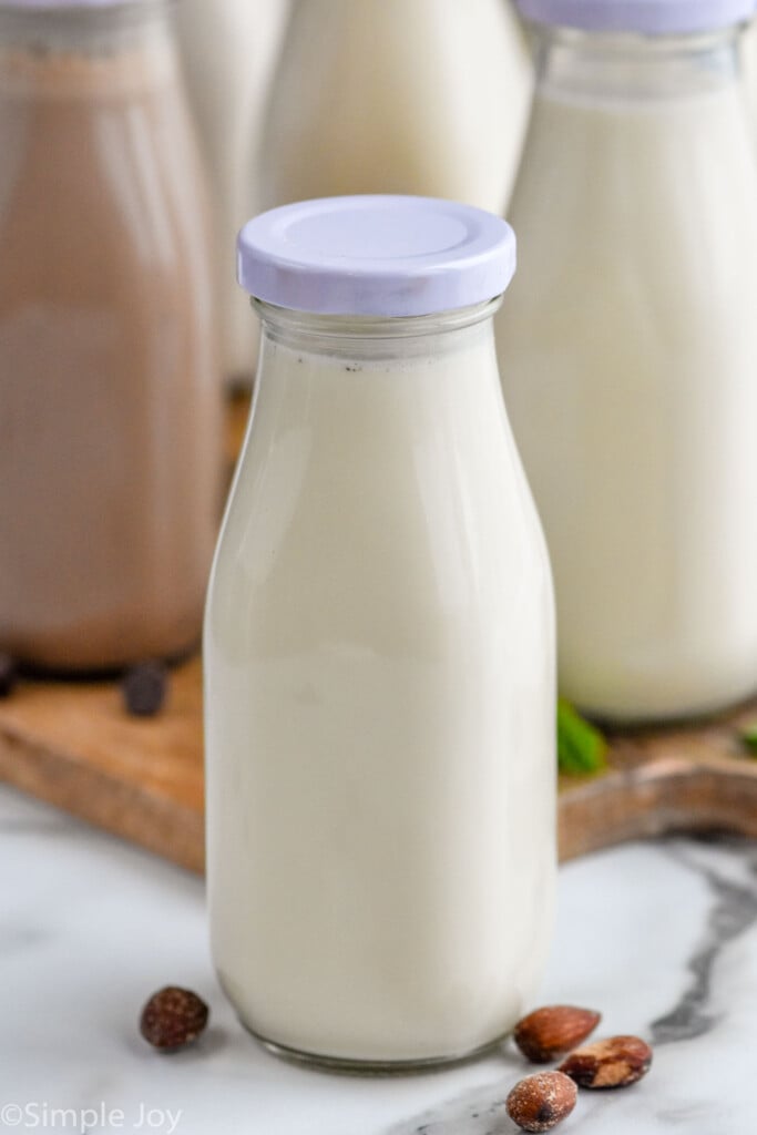 Close up photo of a jar of almond Homemade Coffee Creamer.