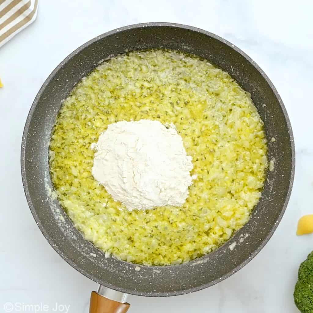 flour added to a skillet with sautéed onion and garlic