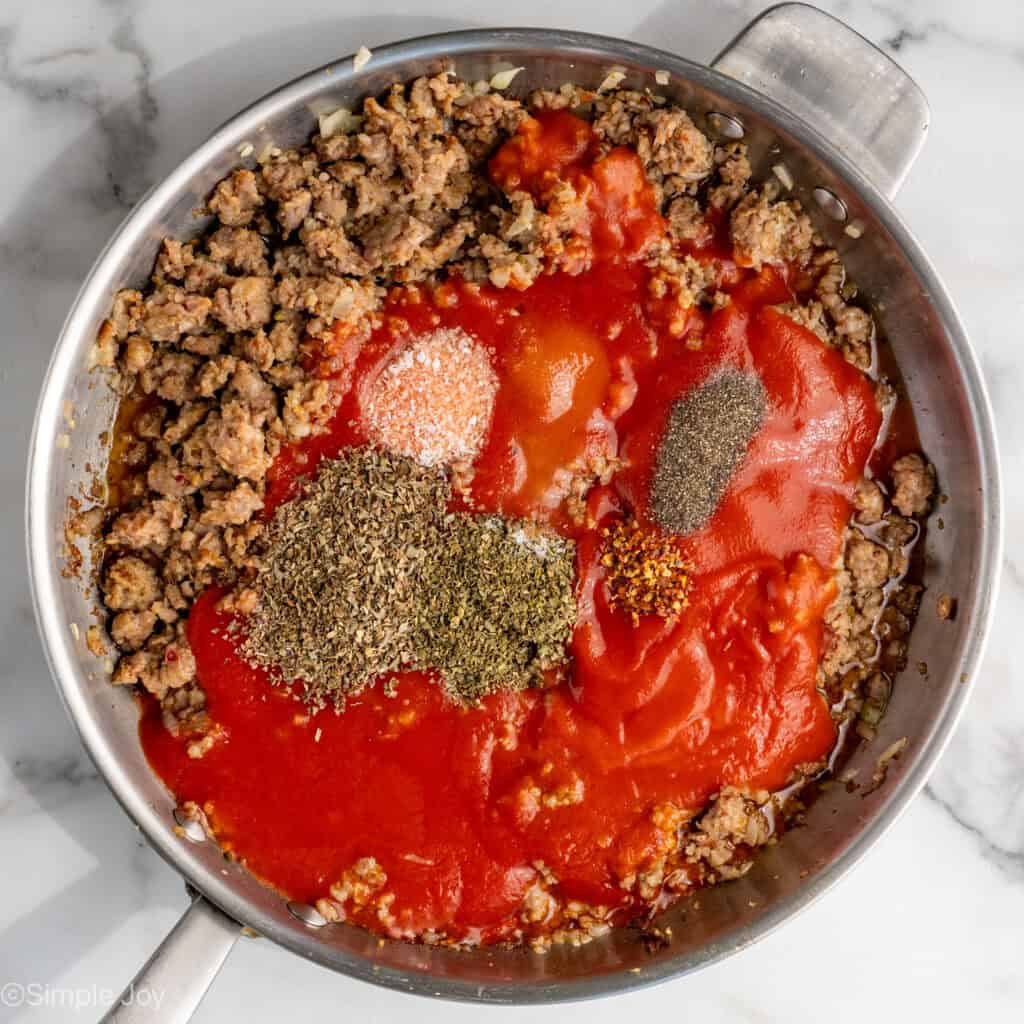 sausage, tomato sauce, and seasonings in a skillet to make meat sauce for lasagna