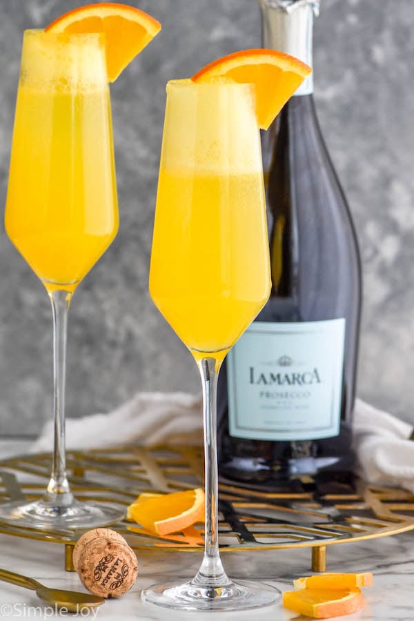 Photo of Mimosa cocktails and a bottle of champagne.