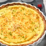 side view of a quiche Lorraine recipe in a fluted thin pie dish