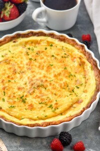 side view of a quiche Lorraine recipe in a fluted thin pie dish