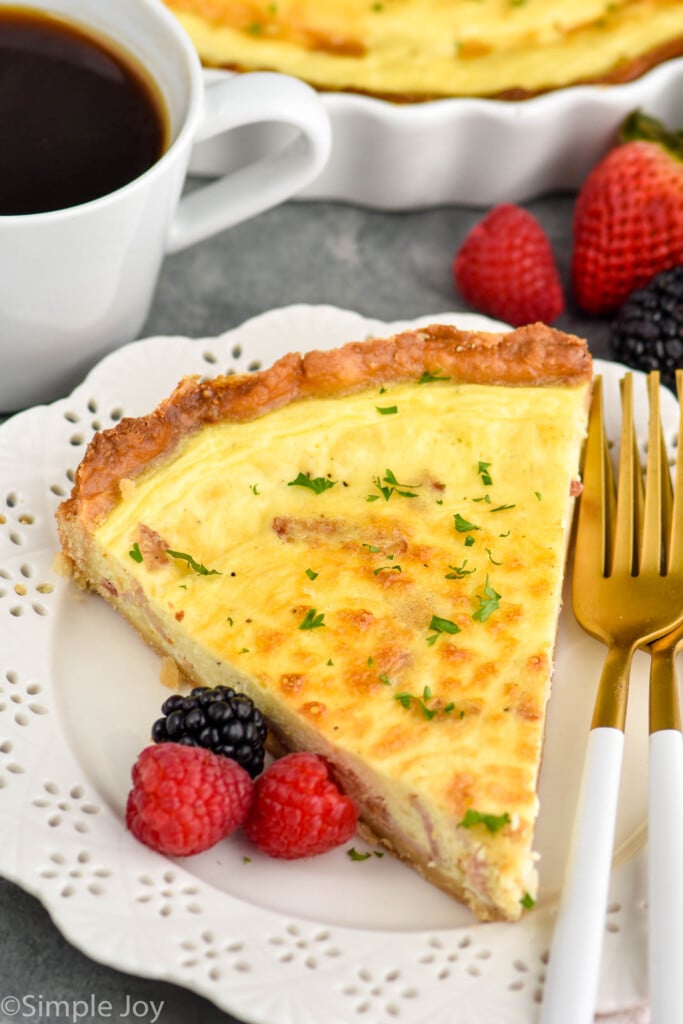 piece of quiche Lorraine recipe on a white plate with some berries