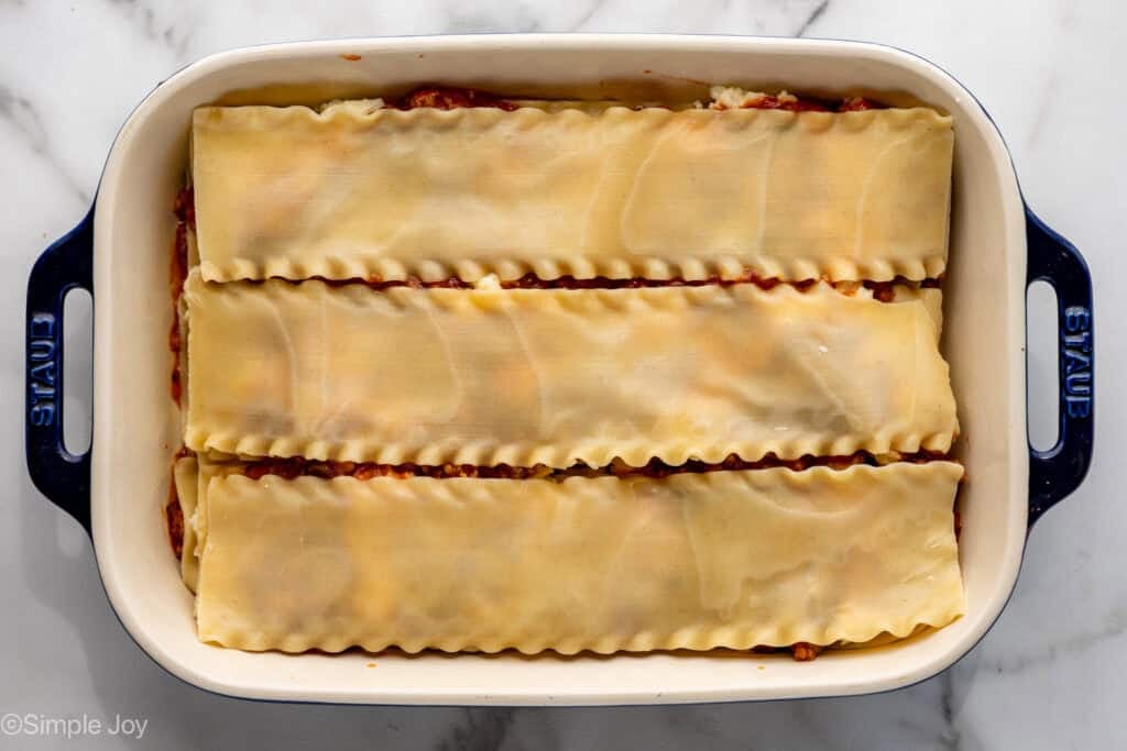 overhead of a layered lasagna without any sauce or cheese on top