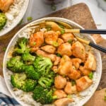 Overhead photo of teriyaki chicken bowl served with broccoli over rice and two forks