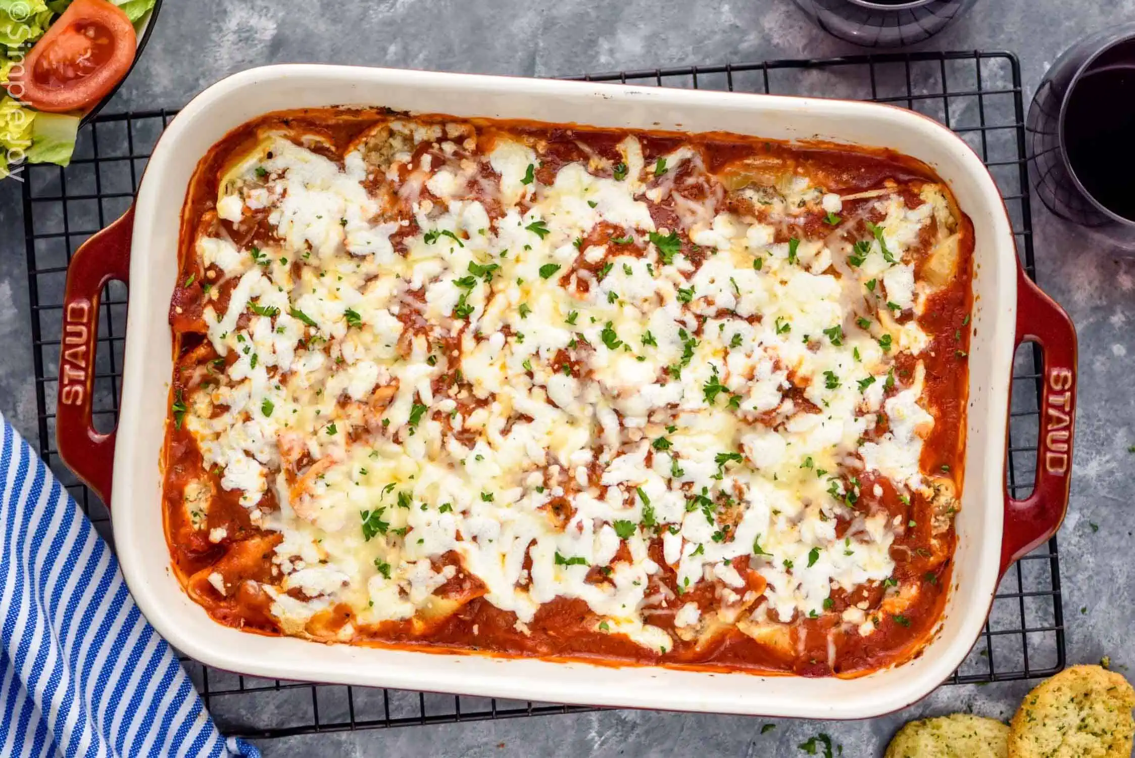 Overhead photo of a baking dish of Stuffed Shells recipe.