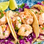 Overhead photo of Bang Bang Shrimp Tacos and lime wedges. - 9