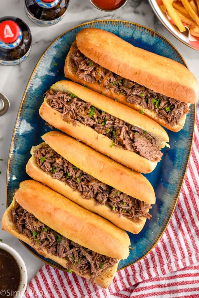 Overhead photo of a platter of French Dip Sandwiches.