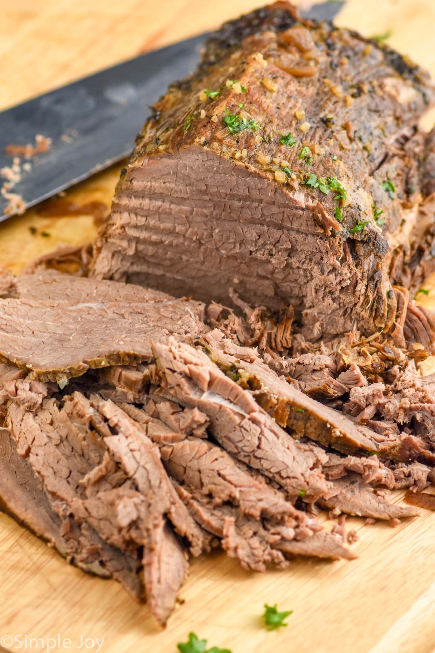 Close up photo sliced beef roast for French Dip Sandwich recipe.