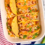 Pinterest graphic for BBQ Chicken Baked Tacos recipe. Image is overhead photo of a baking dish of BBQ Chicken Baked Tacos. Text says, "BBQ Chicken Baked Tacos simplejoy.com"