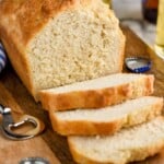 Overhead photo of a loaf of Beer Bread that is half sliced. - 21