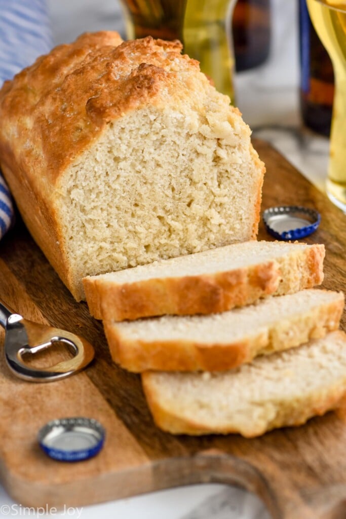 Overhead photo of a loaf of Beer Bread that is half sliced.