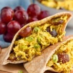 Close up photo of Curry Chicken Salad and grapes.