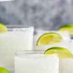 Pinterest graphic for Frozen Margarita recipe. Text says, "the best Frozen Margaritas simplejoy.com." Image is close up photo of