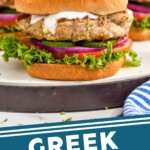 Pinterest graphic for Greek Turkey Burgers. Close up photo of Greek Turkey Burgers served on buns with yogurt sauce, lettuce, tomato, onion, and pickles. Text says, "Greek Turkey Burger simplejoy.com"